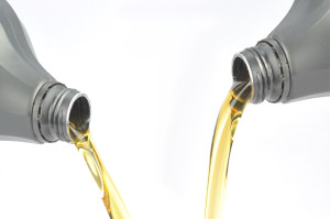 Two bottles pouring lubricant